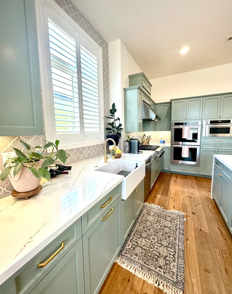 Light refinished cabinets after transformation