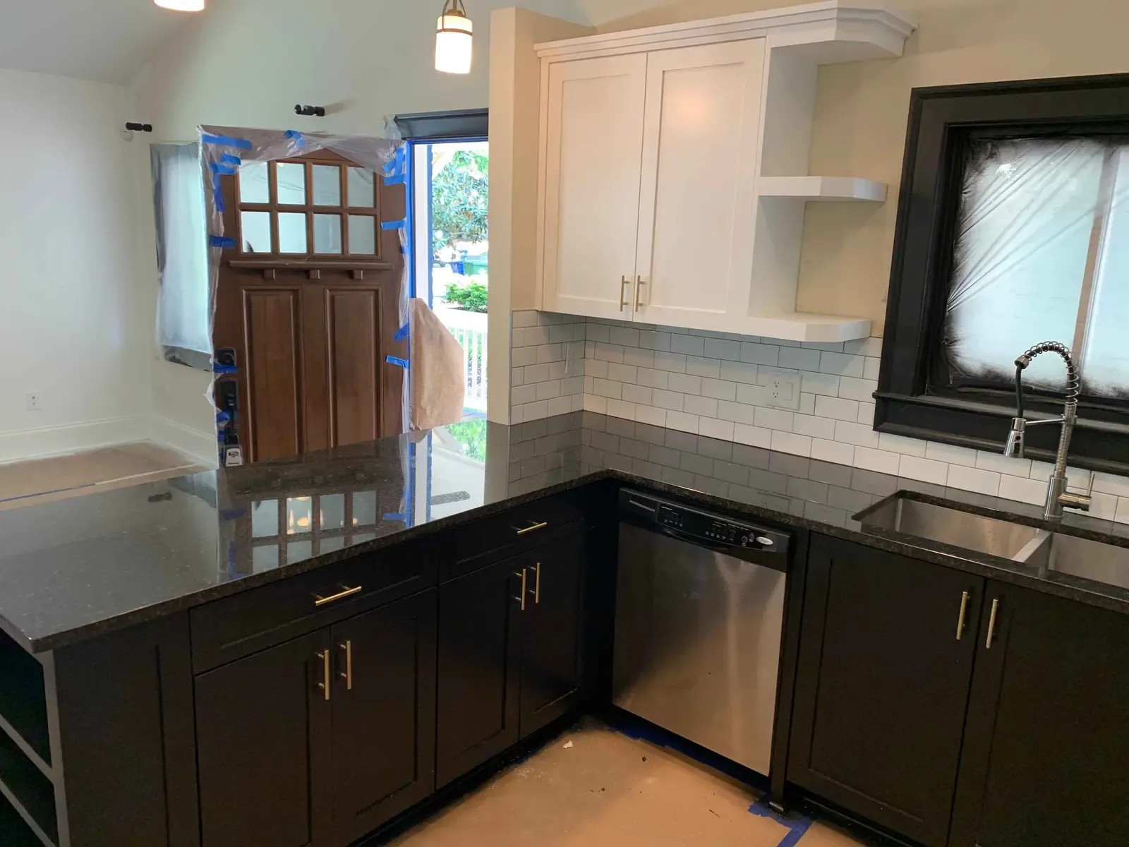 Black and white refinished kitchen cabinetry