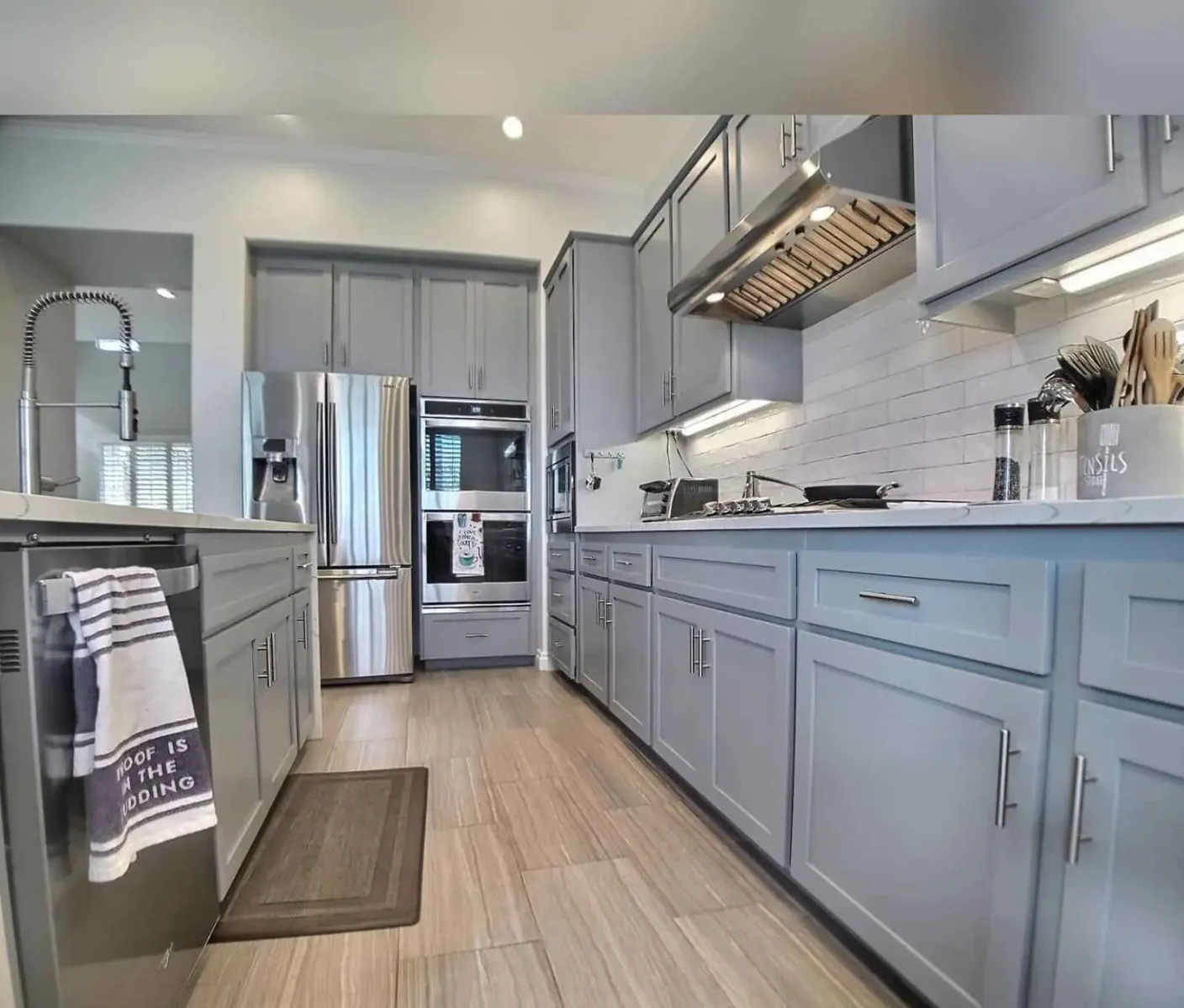 Blue gray painted kitchen cabinets