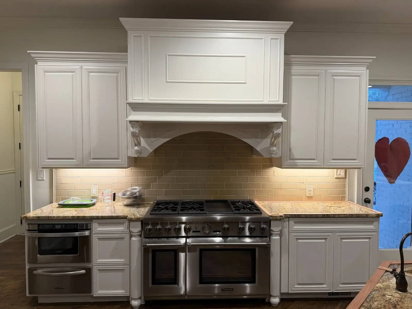 Custom cabinet doors and range hood detail