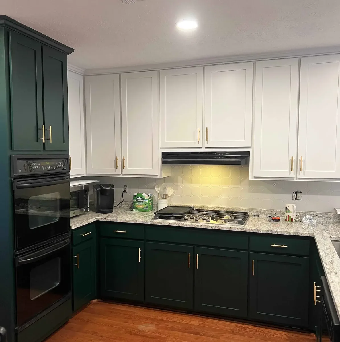 Completed Urban Fresh Services cabinet refinishing project with two-tone cabinetry