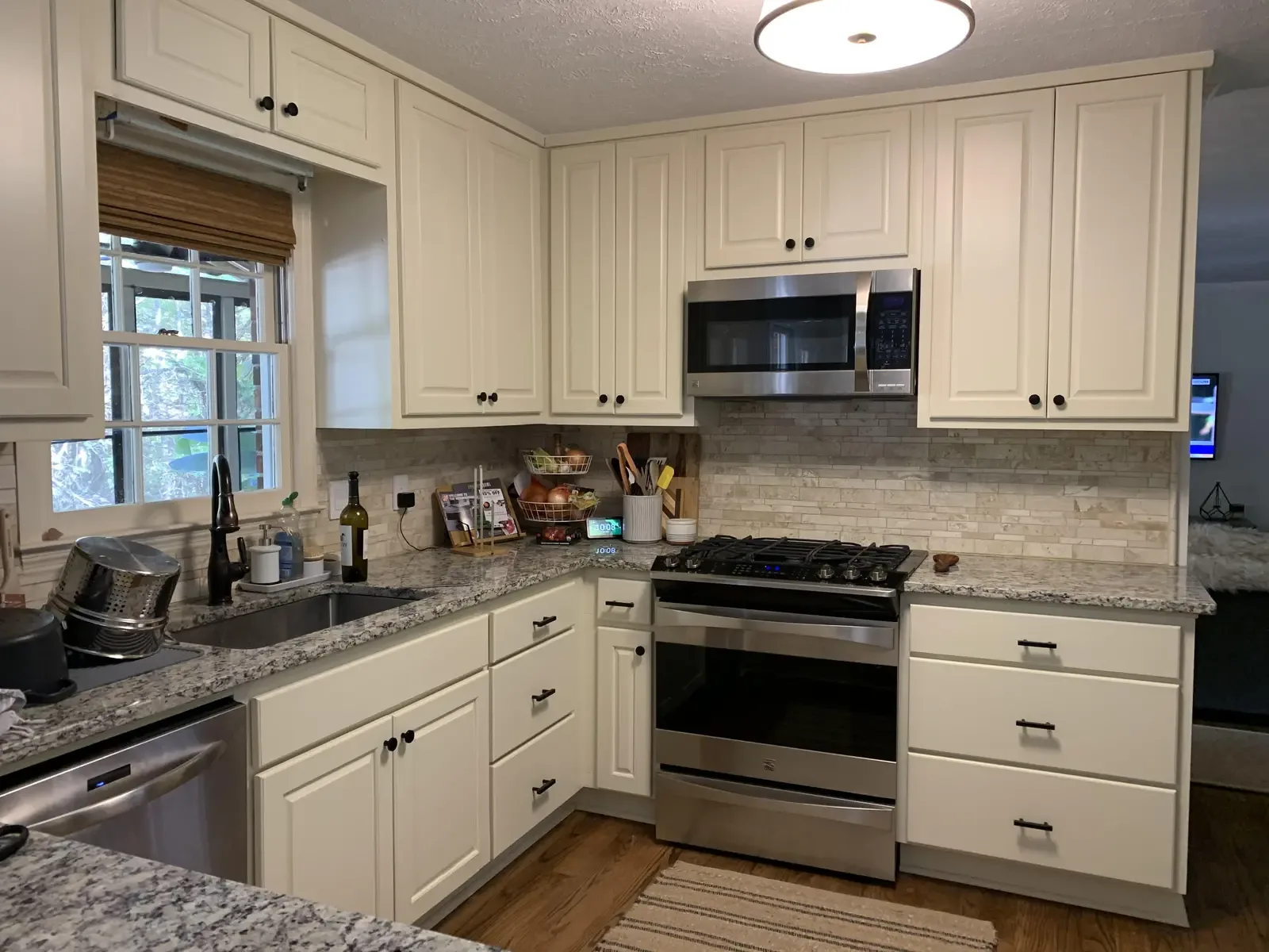 White kitchen after cabinet refinishing
